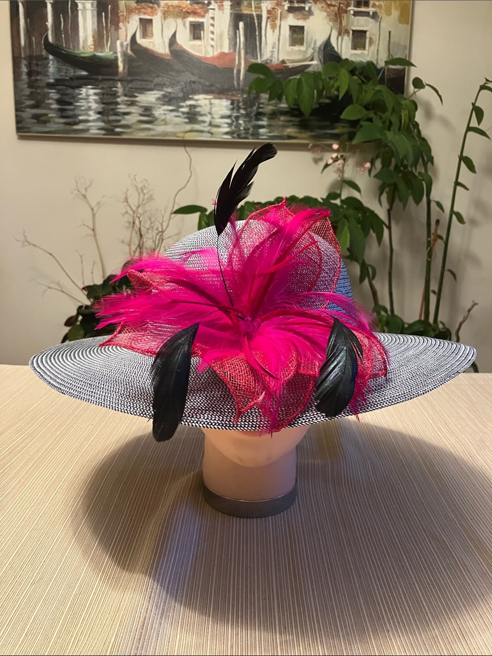 Chic Black and White Wide-Brim Hat with Hot Pink Feather Accent